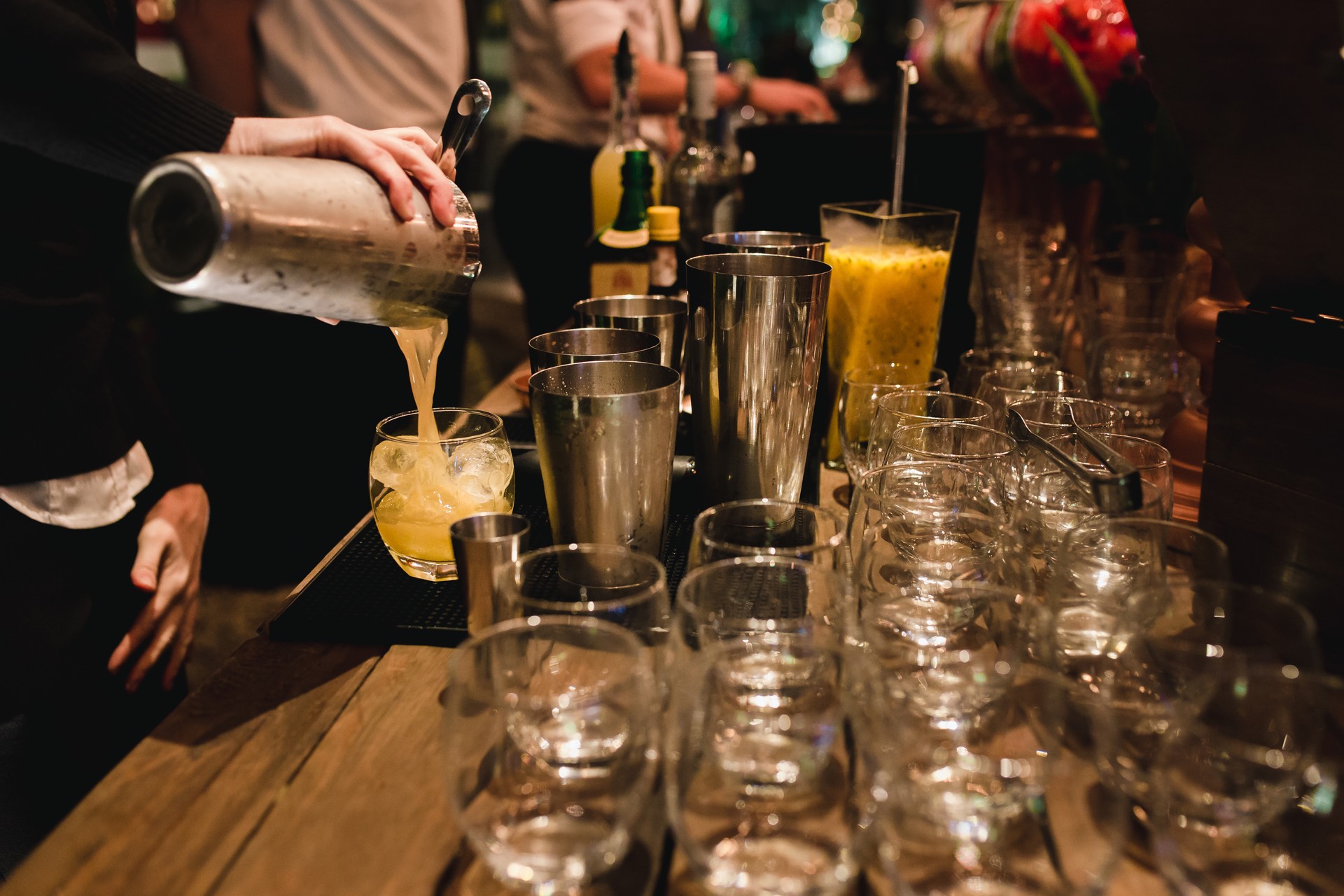 Bartender Serving a brazilian caipirinha