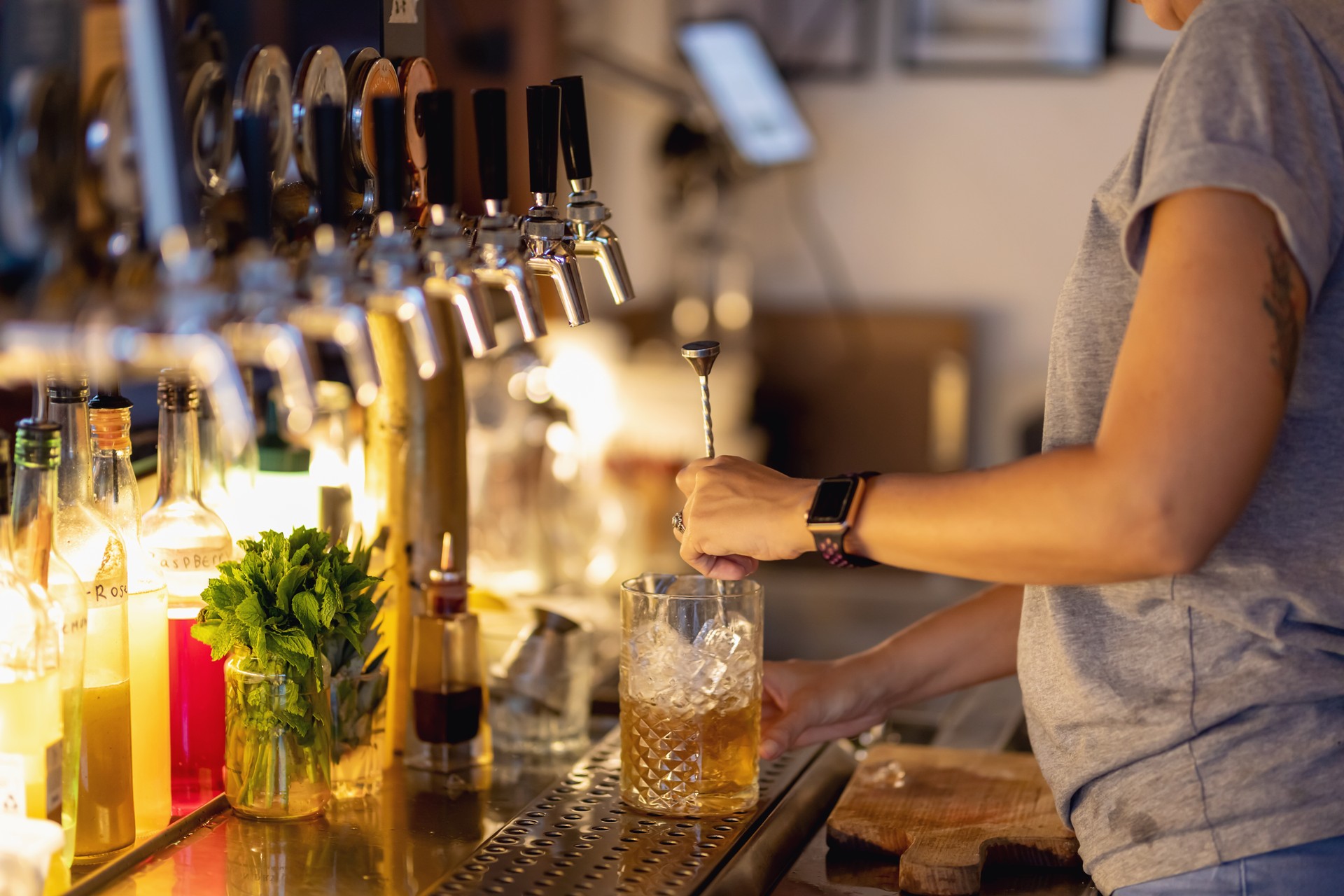 Female Bartender Making Cocktails